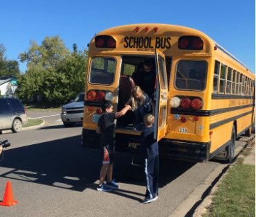 Local students practice school bus evacuation
