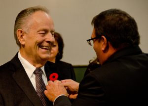 Councillor Ken Baker has his City of Lloydminster pin placed on his suit by Lloydminster mayor Gerald Aalbers. Photo by James Wood/106.1 The Goat/Vista Radio 