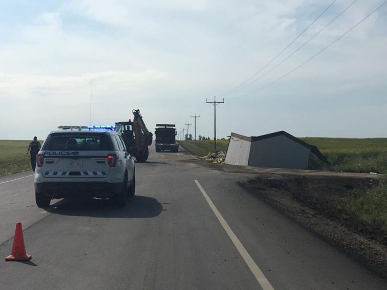 Road Re-Opened After House falls off of Trailer Carrying it