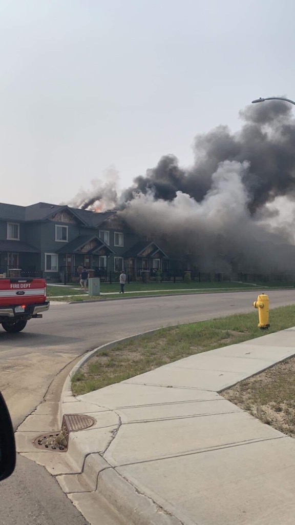 Emergency crews battle blaze at townhouses