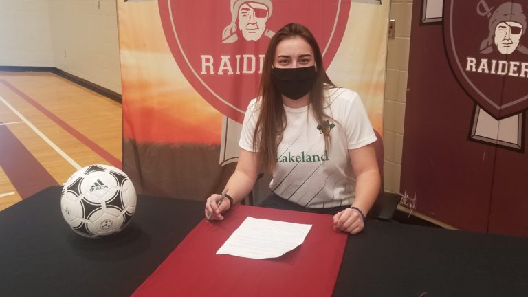 Holy Rosary soccer players signs with Lakeland College