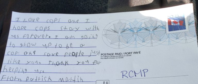 Lloydminster RCMP are all smiles with a postcard