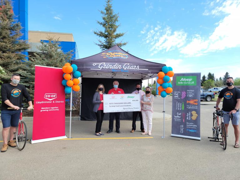 Bike for Breakfast YLL are closer to their goal as local grocers ring in some hefty dollars