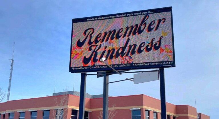 Remember Kindness billboard lights the path for citizenship award