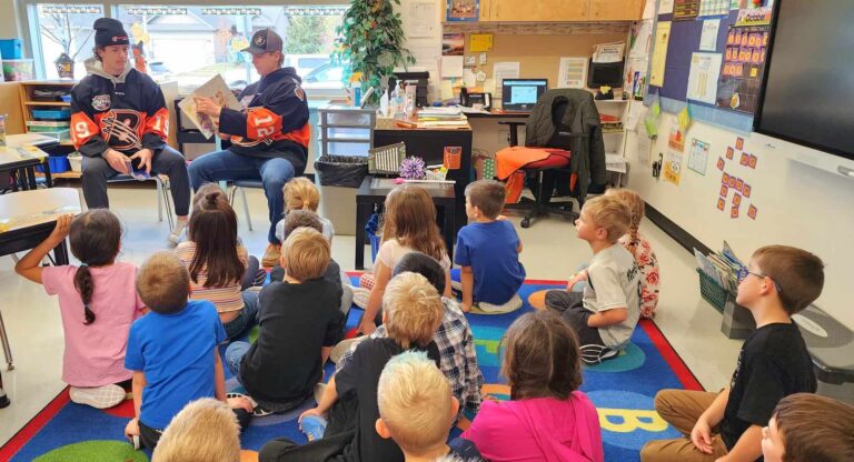 Bobcats players pick up books for library week