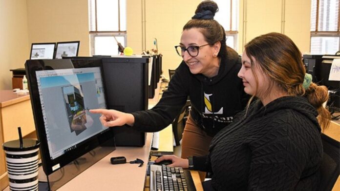 Rochelle Horne, program head for interior design technology with a student at Lakeland College. Photo credit: Lakeland College.