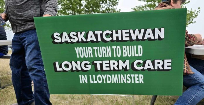 Sign informing the Saskatchewan government its their turn to build long term care spaces on the Saskatchewan side of Lloydminster.
