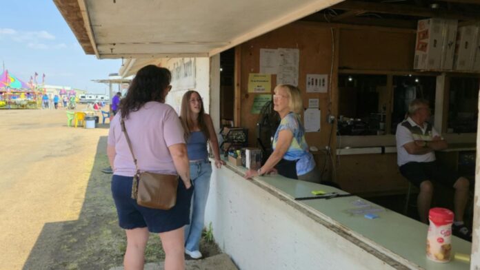 Volunteers serving at Grace United food booth at Lloyd Ex Fair