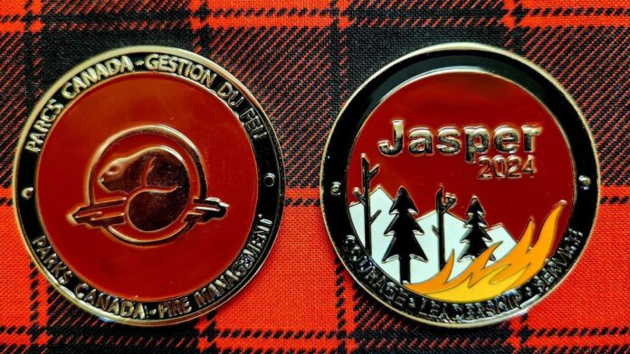 Commemorative coins from Parks Canada presented to Protective Services - County of Vermilion River. | Photo credit: County of Vermilion River, social media.