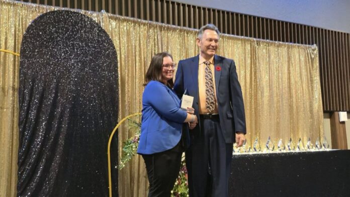 Dr. Richard Starke honoured with Lifetime Achievement Award during Business Excellence Awards. L-R: President of Lloydminster Chamber of Commerce, Jackie Tomayer, Dr. Richard Starke. | Photo: 106.1 The Goat/Vista Radio.