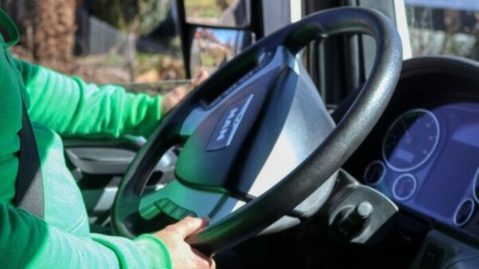 FILE: Driver's hand holding steering wheel inside truck. | Photo credit: Pixabay.