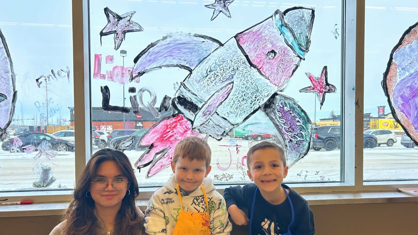 Mother Teresa students have painted the windows at Sobeys, Lloydminster to launch their donut fundraiser. | Photo credit: LCSD.