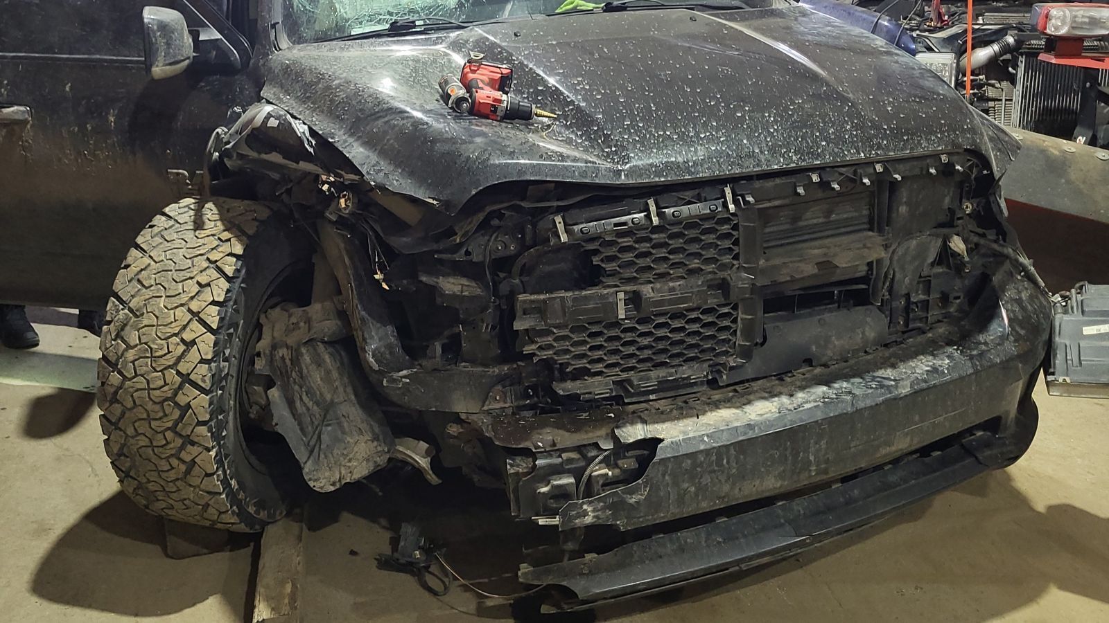 Suspect vehicle damage after ramming police vehicle. | Photo credit: Alberta RCMP.