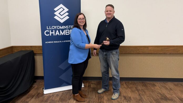 New Lloydminster Chamber president, Robbie Kaschl receives the ceremonial gavel from outgoing president Jackie Tomayer. | Photo credit: Lloydminster Chamber of Commerce, socials.